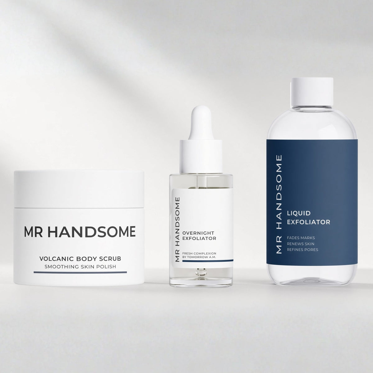 Three exfoliators for men by MR HANDSOME: A body scrub with volcanic sand, an overnight exfoliator with 10% AHA and a liquid exfoliator with 5% glycolic acid